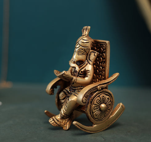 Superfine Reading Ganesha Sitting On Rocking Chair In 7 Inch