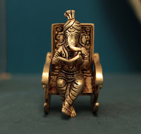 Superfine Reading Ganesha Sitting On Rocking Chair In 7 Inch