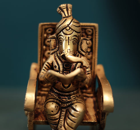 Superfine Reading Ganesha Sitting On Rocking Chair In 7 Inch