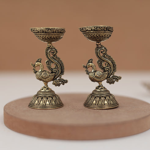 Antique Finish Brass Peacock Diya Pair in 3 Inches Antique Finish Brass Peacock Diya Pair in 3 Inches
