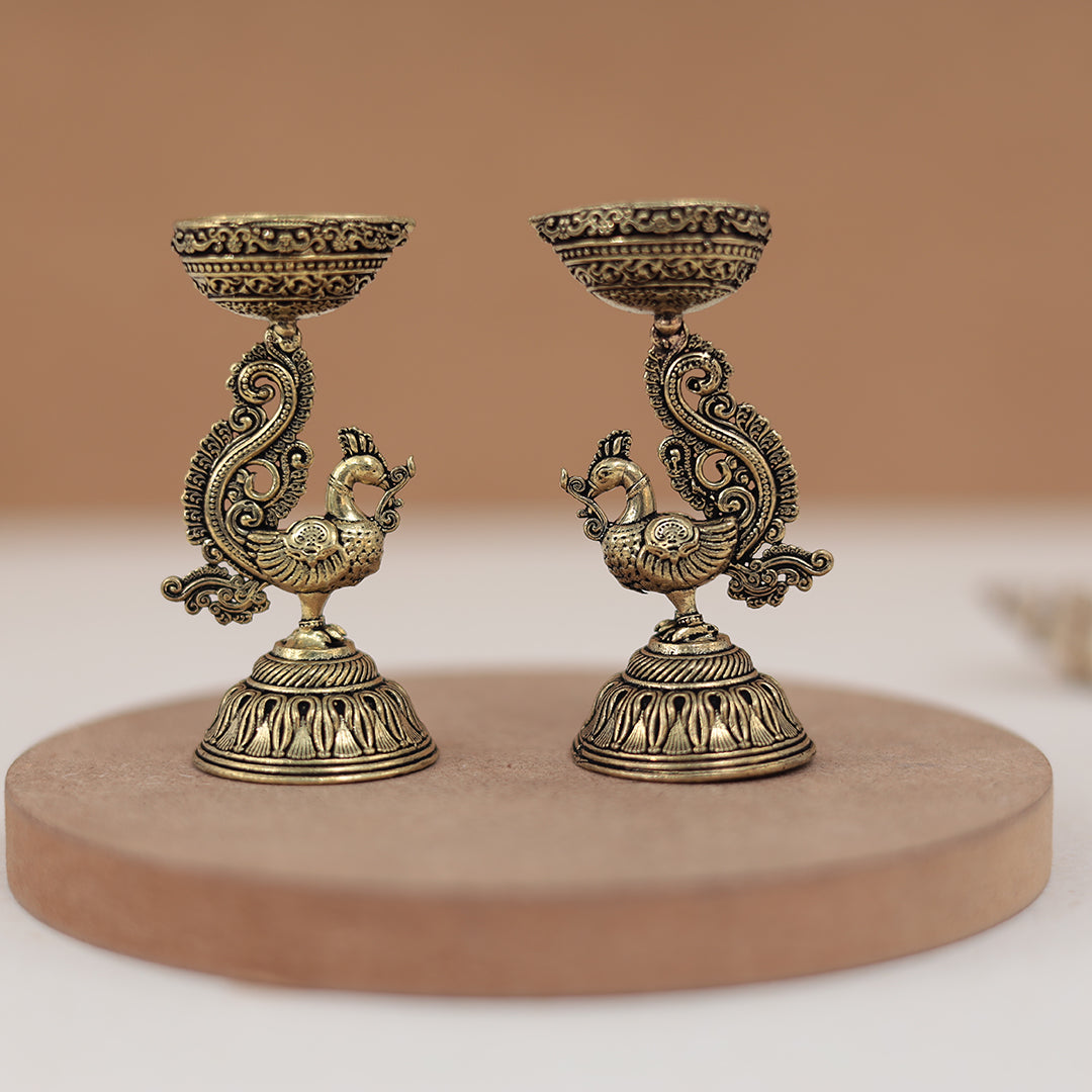 Antique Finish Brass Peacock Diya Pair in 3 Inches Antique Finish Brass Peacock Diya Pair in 3 Inches